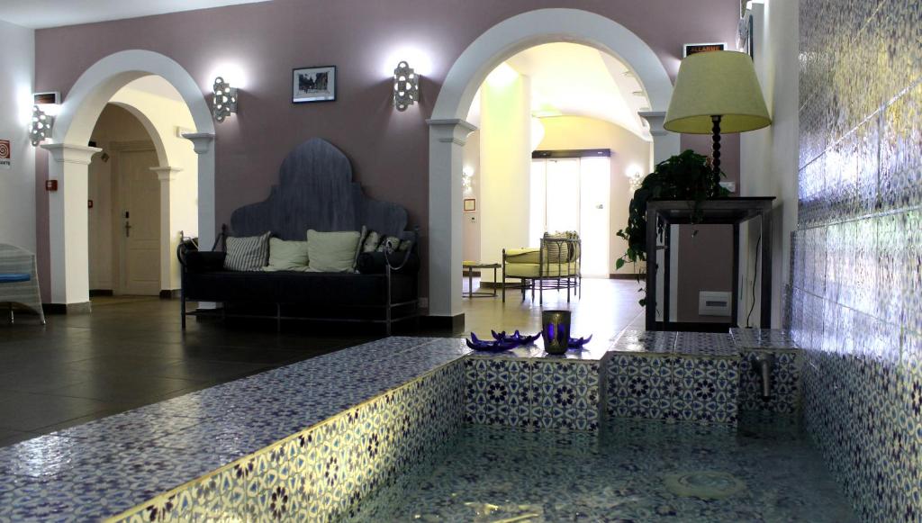 a living room with a couch and a table at Hotel O'scià in Lampedusa