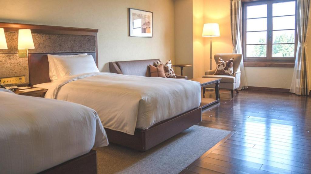Postel nebo postele na pokoji v ubytování Lotte Arai Resort