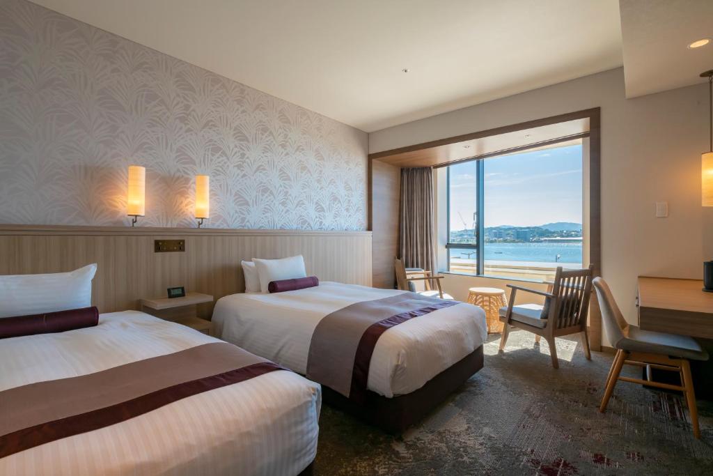 Postel nebo postele na pokoji v ubytování Hotel Ichibata