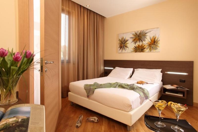 Postel nebo postele na pokoji v ubytování Hotel & Spa Villa Mercede