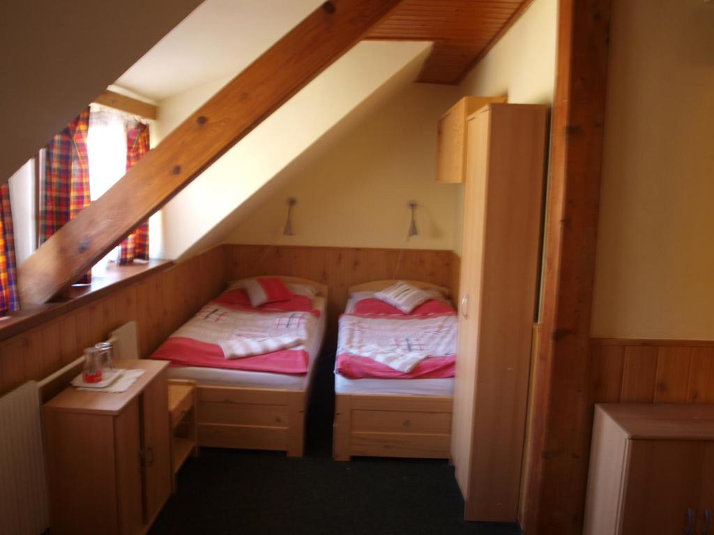 Postel nebo postele na pokoji v ubytování Hotel Kormoran