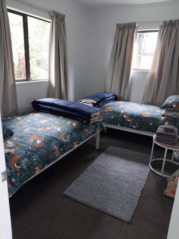Postel nebo postele na pokoji v ubytování Kea Retreat
