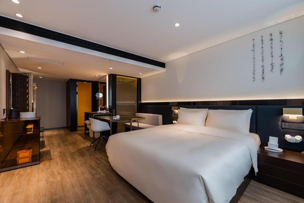 Postel nebo postele na pokoji v ubytování Atour S Hotel Shanghai Lujiazui Financial Center