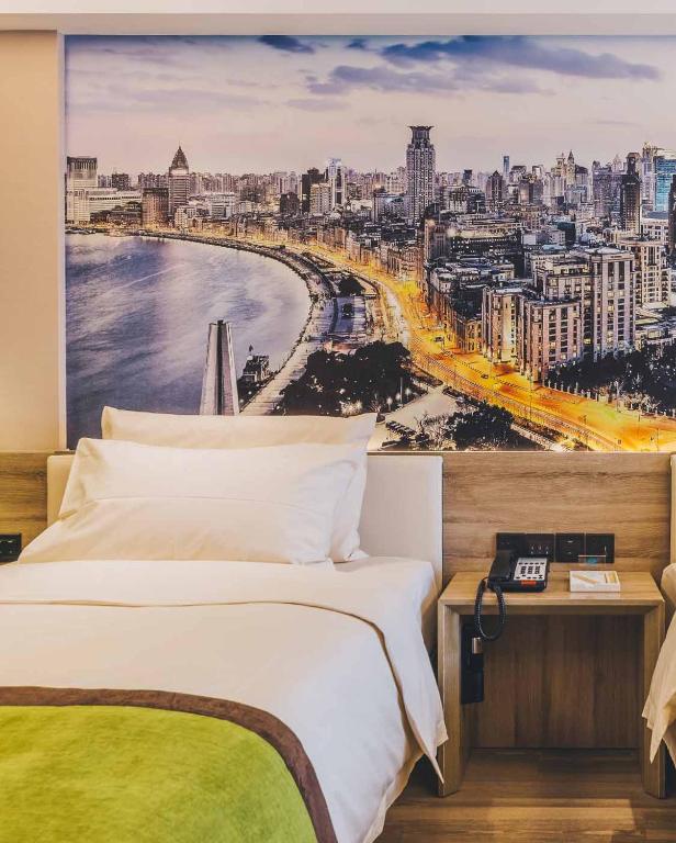 Postel nebo postele na pokoji v ubytování Atour Hotel Shanghai Lujiazui Babaiban