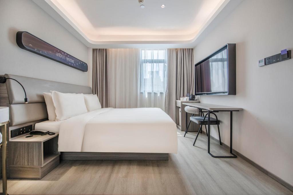 Postel nebo postele na pokoji v ubytování Atour Hotel Zhuhai Gongbei Port Fuhuali CBD