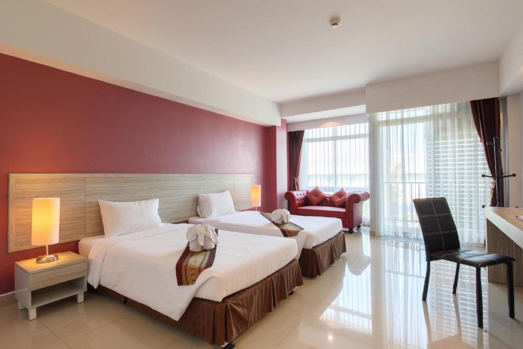 Postel nebo postele na pokoji v ubytování Tubtim Siam Suvarnabhumi Hotel