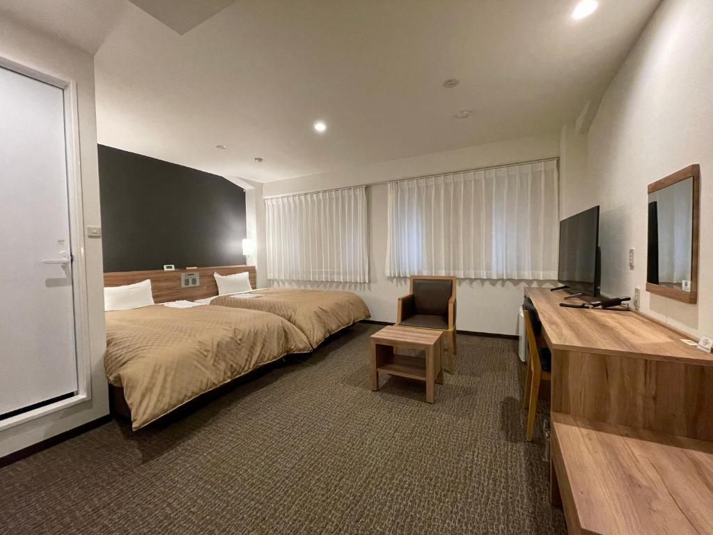 TV a/nebo společenská místnost v ubytování Kusatsu Daiichi Hotel