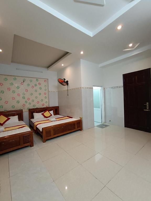 Postel nebo postele na pokoji v ubytování Motel Toàn Thắng