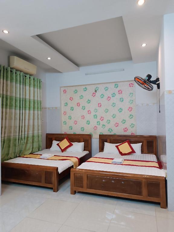 Postel nebo postele na pokoji v ubytování Motel Toàn Thắng