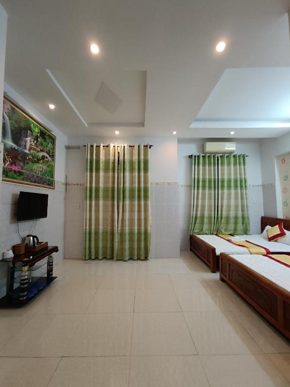 Postel nebo postele na pokoji v ubytování Motel Toàn Thắng
