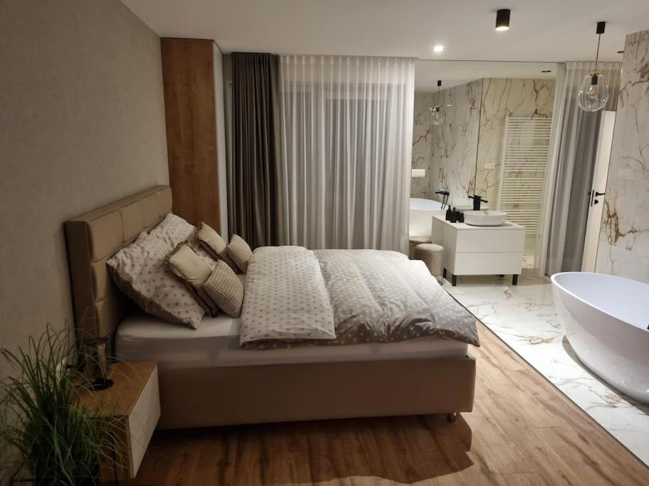 A bed or beds in a room at Krásný apartman s vybavením a bezplatným parkovanim