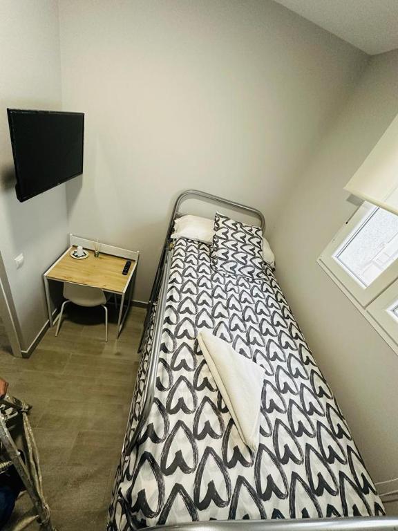 A bed or beds in a room at HOSPEDAJE CUATRO VIENTOS