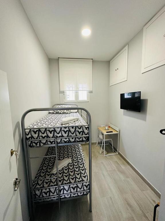 A bed or beds in a room at HOSPEDAJE CUATRO VIENTOS