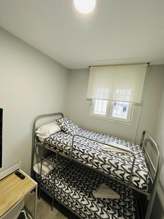 A bed or beds in a room at HOSPEDAJE CUATRO VIENTOS