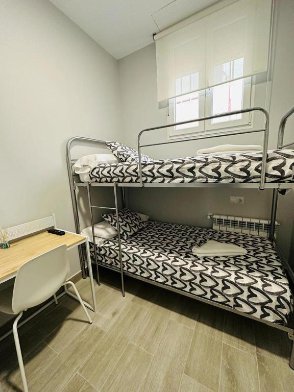 A bed or beds in a room at HOSPEDAJE CUATRO VIENTOS