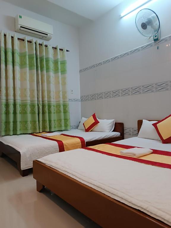 Postel nebo postele na pokoji v ubytování Motel Toàn Thắng