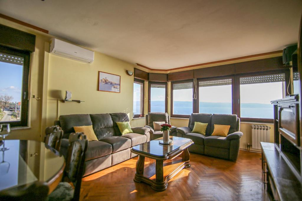 a living room with two couches and a table at Danijela in Jesenice