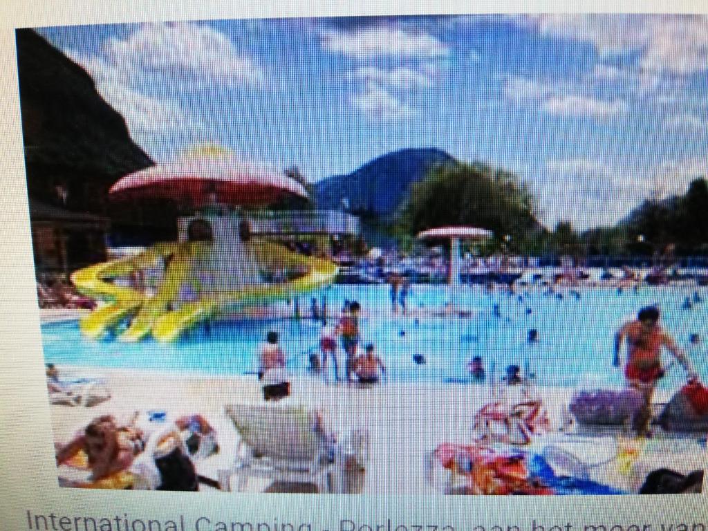 a group of people in a pool at a water park at 5 Personen Chalet am Luganer See in Porlezza