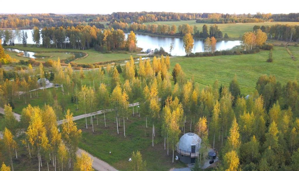 an aerial view of a farm with a barn and trees at Glamping DiDille in Drusti