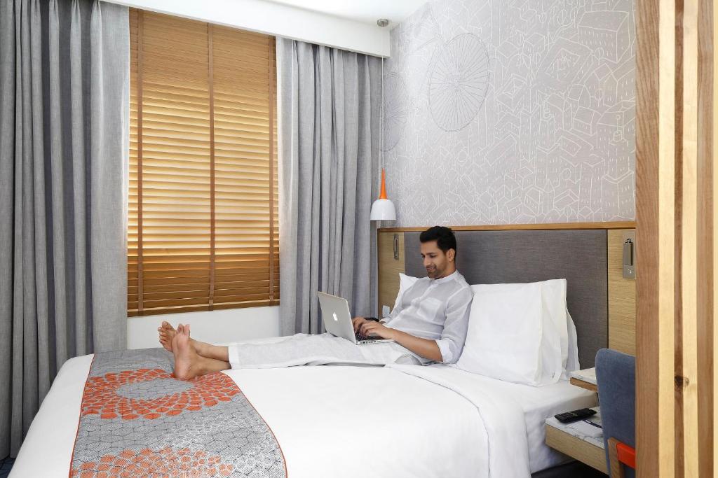 Postel nebo postele na pokoji v ubytování Holiday Inn Express Pune Pimpri by IHG