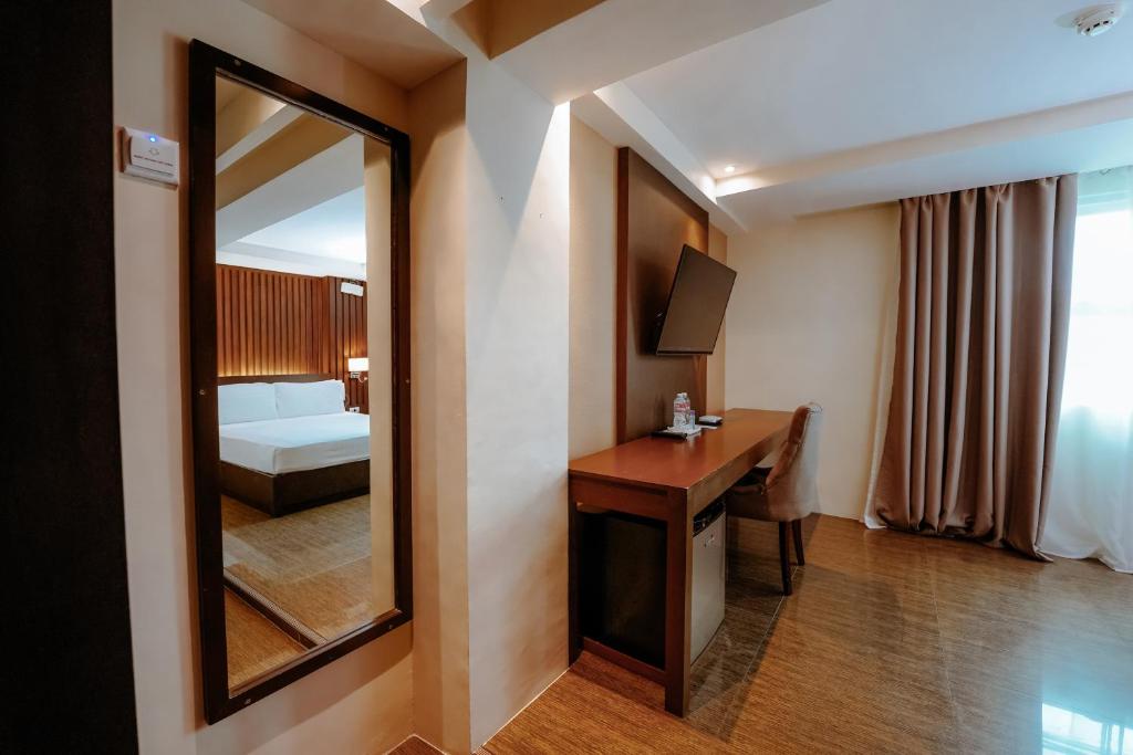 Postel nebo postele na pokoji v ubytování Emerald Boutique Hotel