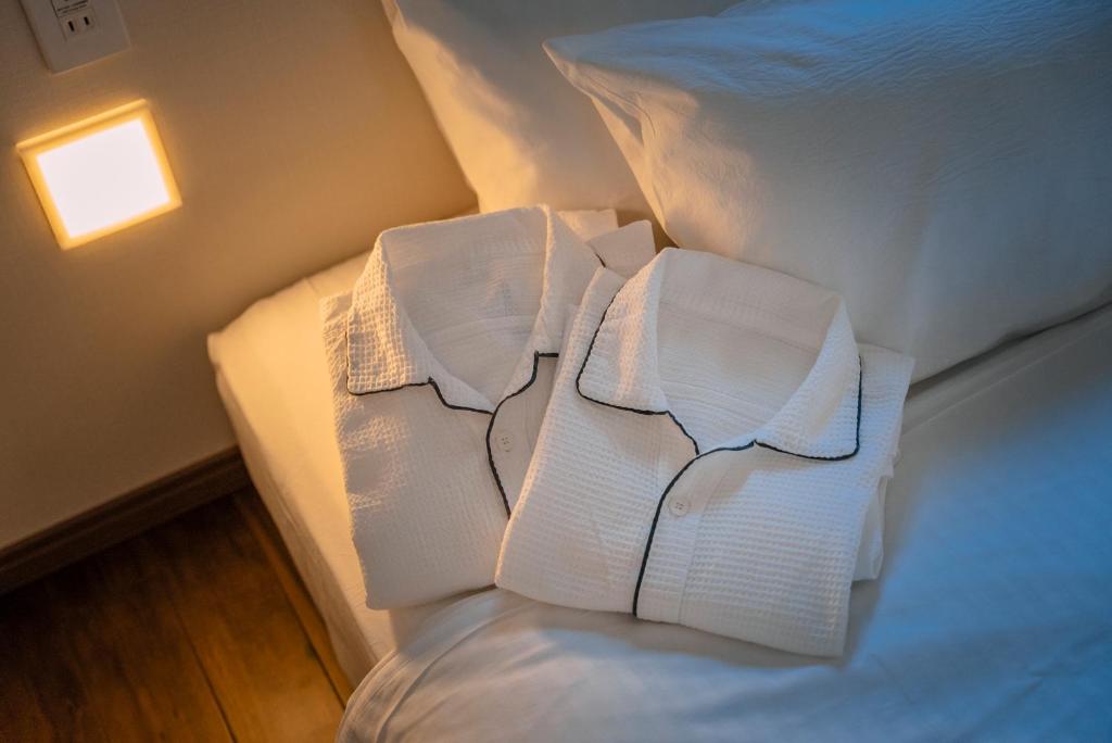 Postel nebo postele na pokoji v ubytování 谷町君Hotel Crush On 京都四条烏丸