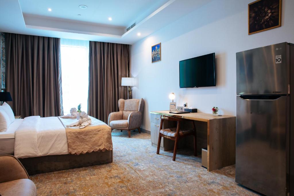 TV a/nebo společenská místnost v ubytování Al Mansour Plaza Hotel