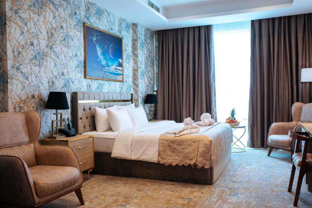 Postel nebo postele na pokoji v ubytování Al Mansour Plaza Hotel