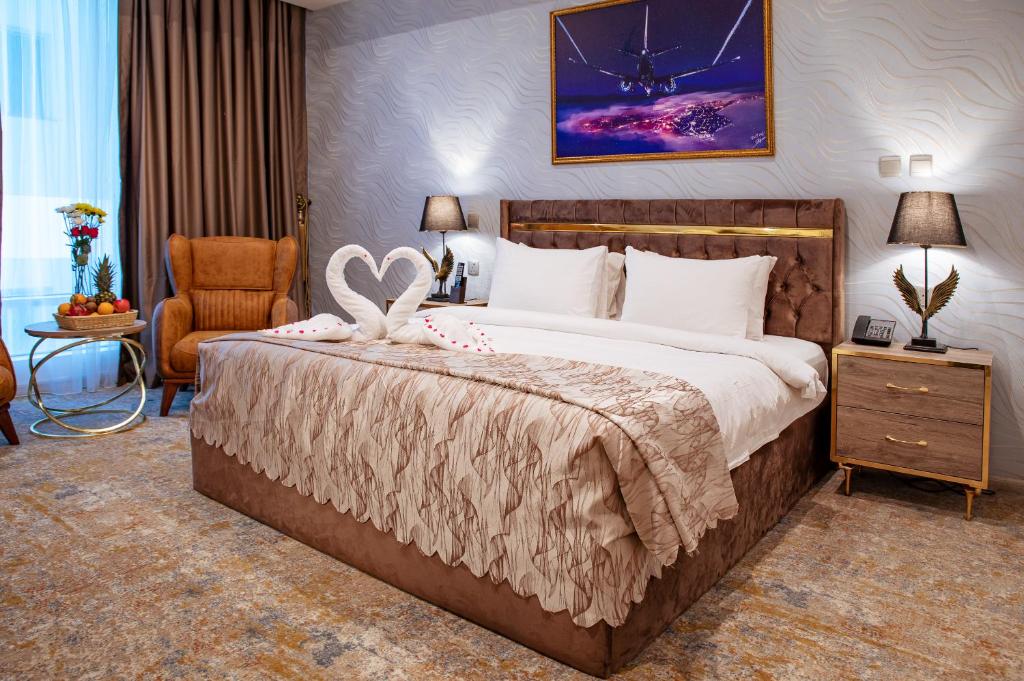 Postel nebo postele na pokoji v ubytování Al Mansour Plaza Hotel