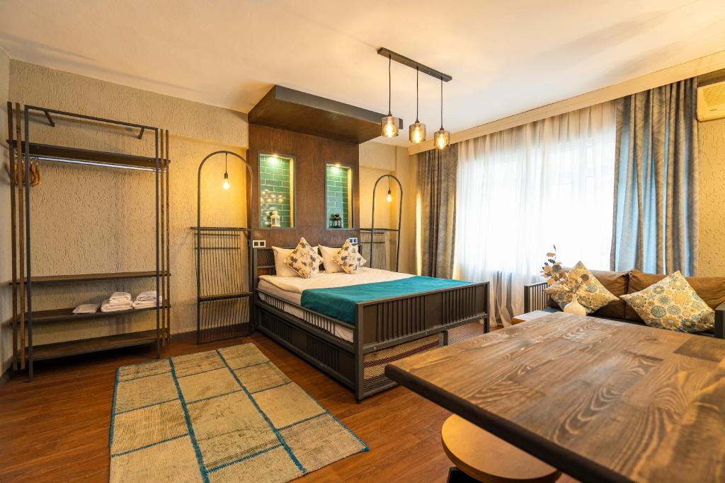 Ένα ή περισσότερα κρεβάτια σε δωμάτιο στο Cube Suites