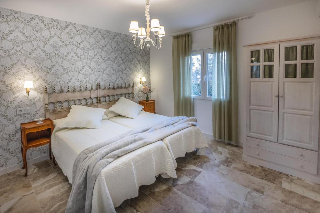 Postel nebo postele na pokoji v ubytování Casa Rural Majada del Conde