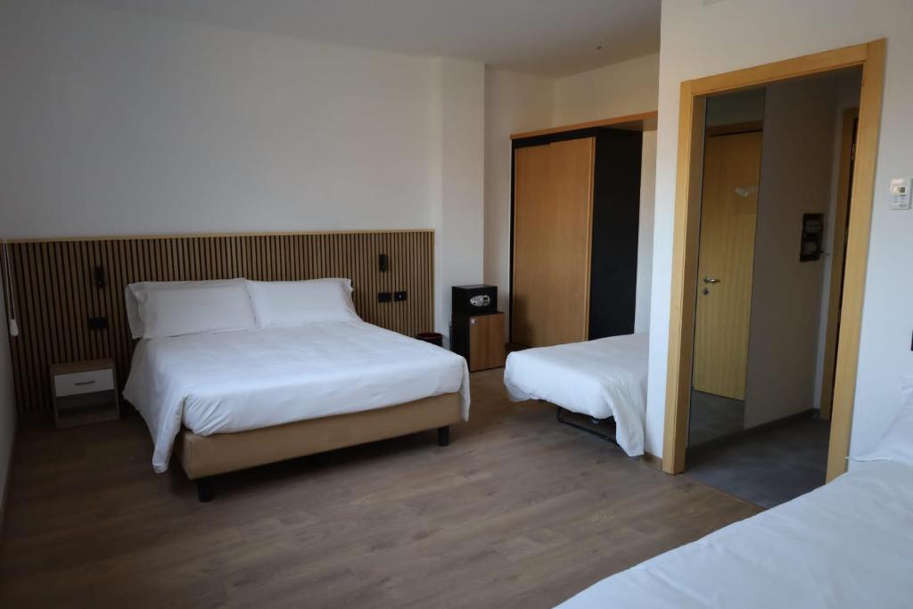 Postel nebo postele na pokoji v ubytování Moon Palace Hotel