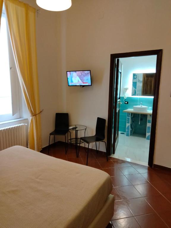 Posteľ alebo postele v izbe v ubytovaní Dante Rooms