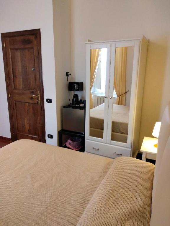 Posteľ alebo postele v izbe v ubytovaní Dante Rooms
