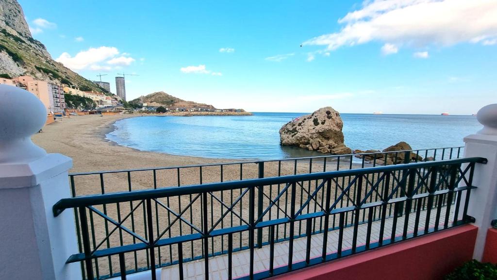 a view of the beach from a balcony at New beachfront duplex - sleeps up to 4 in Gibraltar