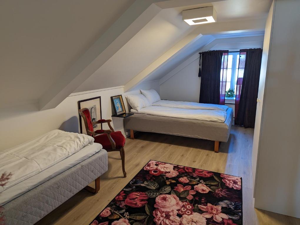 Postel nebo postele na pokoji v ubytování Magasinet