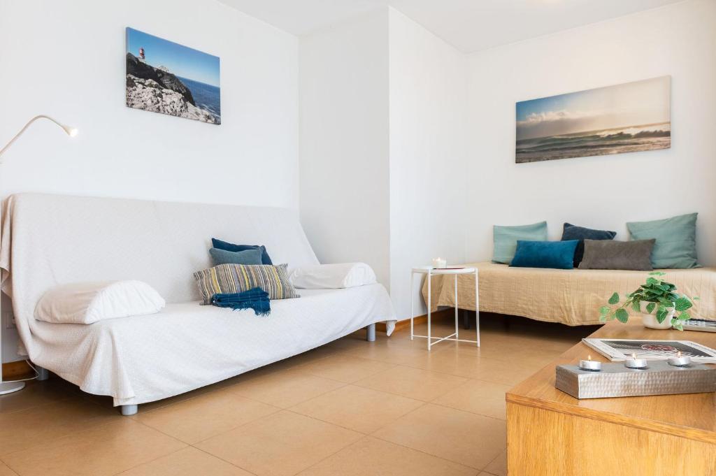 a living room with two beds and a couch at Atlantic Sagres in Sagres