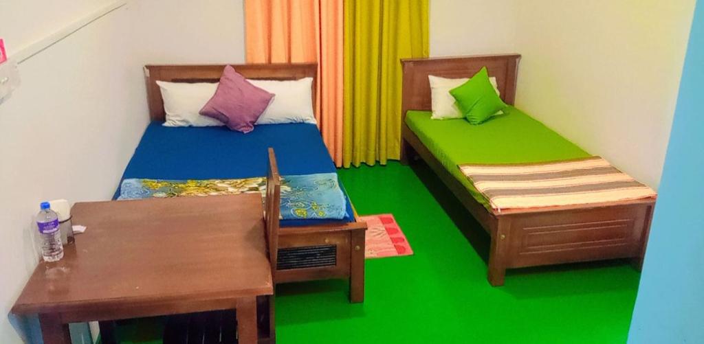 Postel nebo postele na pokoji v ubytování New Mount Villa