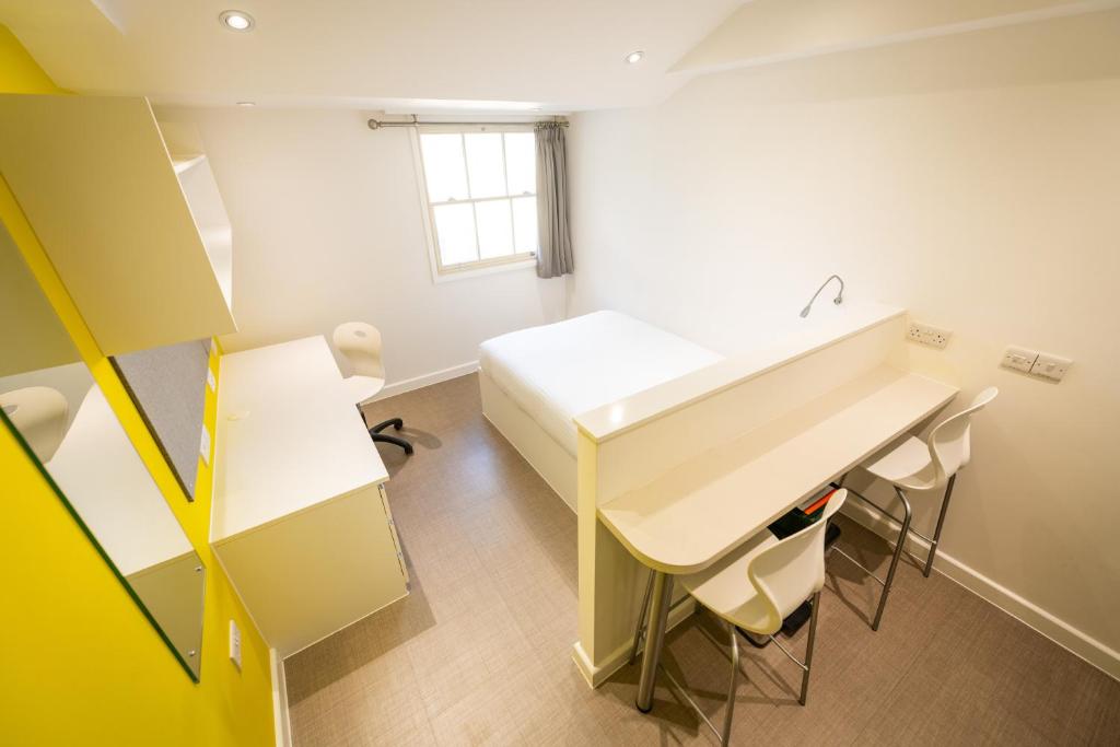 a bathroom with a sink and a table at University of Bath City Accommodation in Bath