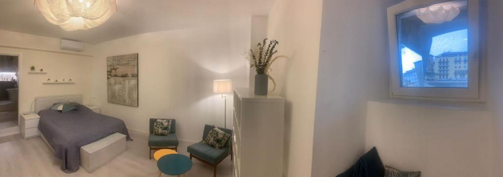 A seating area at The secret window on the river Arno