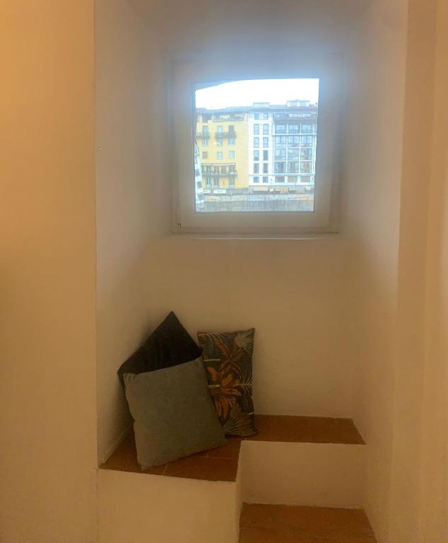 A seating area at The secret window on the river Arno