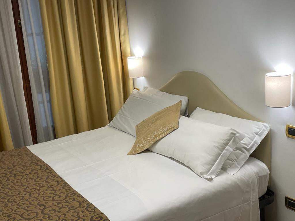 Postel nebo postele na pokoji v ubytování Residenza Favaro