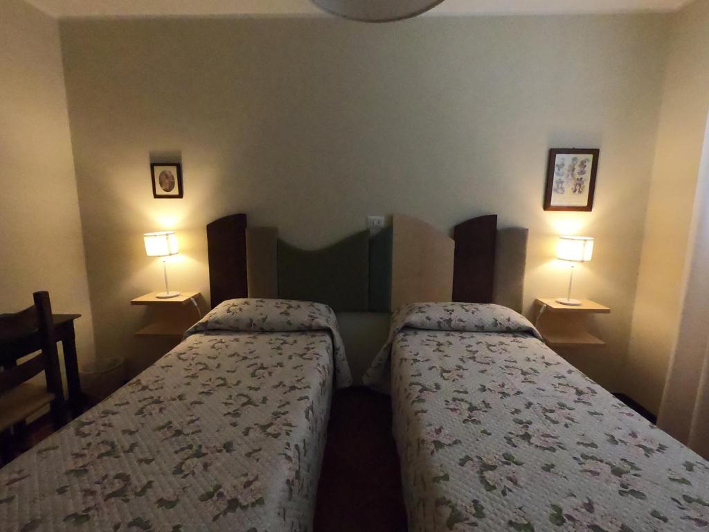 Postel nebo postele na pokoji v ubytování La Locanda del Collaccio