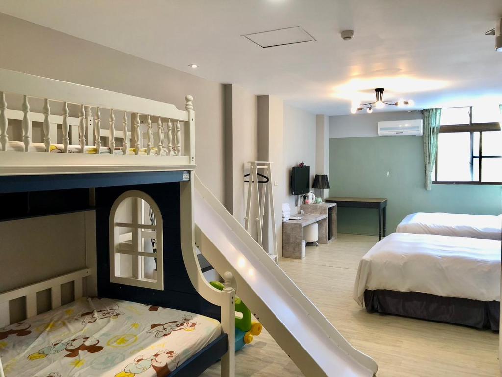 Postel nebo postele na pokoji v ubytování Sun Moon Lake Loft Inn