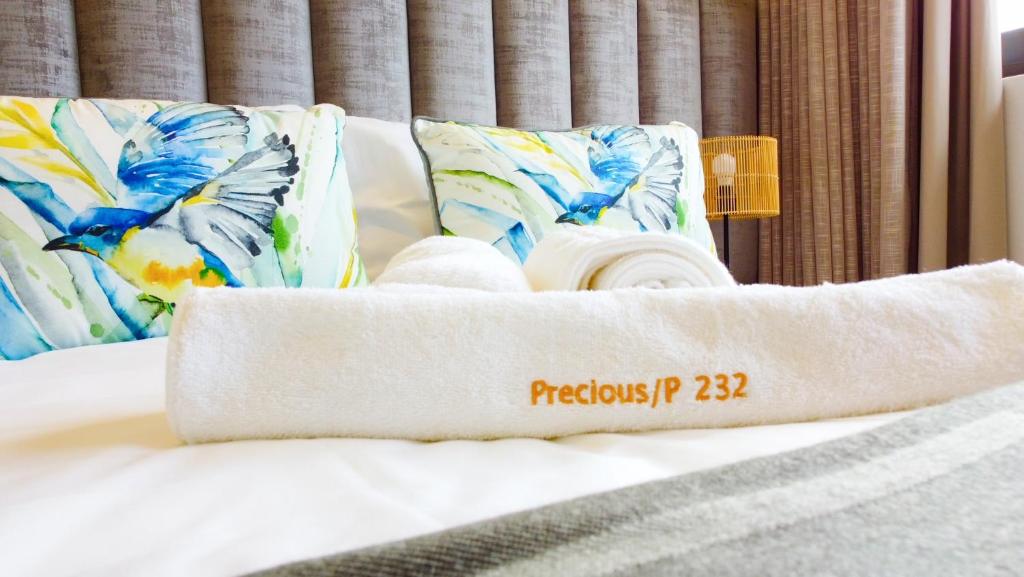 A bed or beds in a room at Precious Paradise Zimbali Blvd