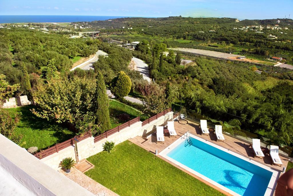 an aerial view of a villa with a swimming pool at Polemarchi Mystique Villa in VoukoliaÃ­