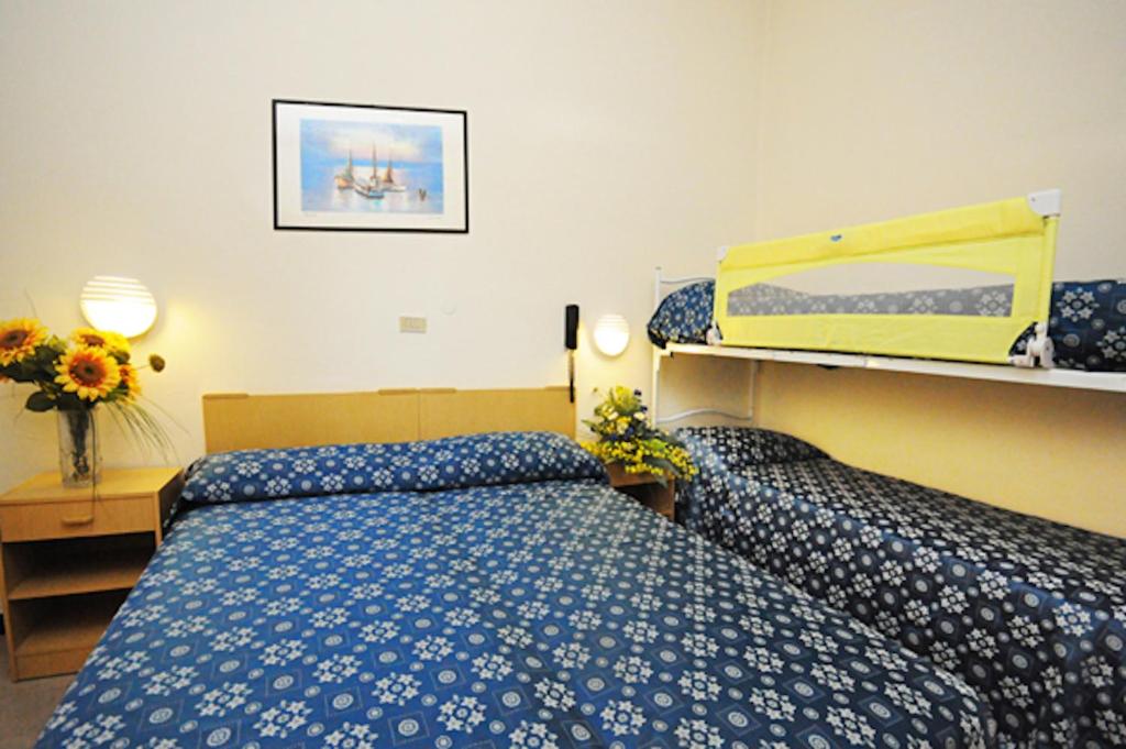 Postel nebo postele na pokoji v ubytování Hotel Marina