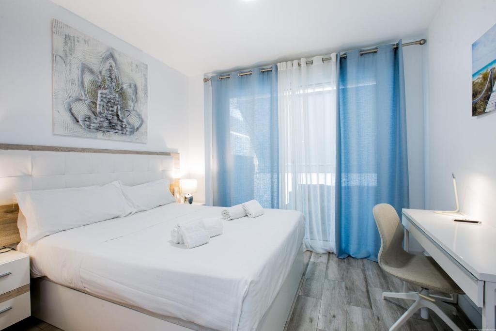 Posteľ alebo postele v izbe v ubytovaní 1 9 Tesoro Galeon Spa y Gym
