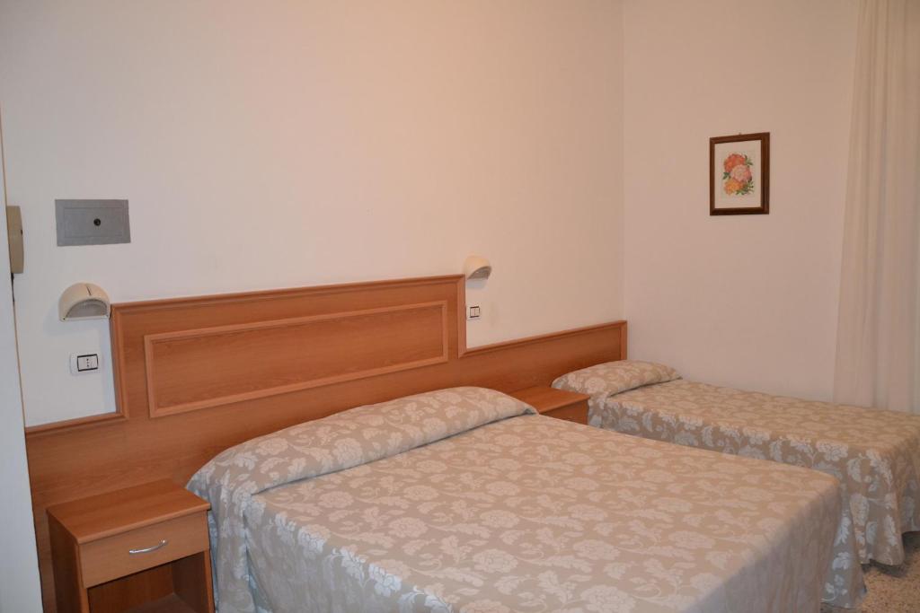 Postel nebo postele na pokoji v ubytování Hotel Ariston