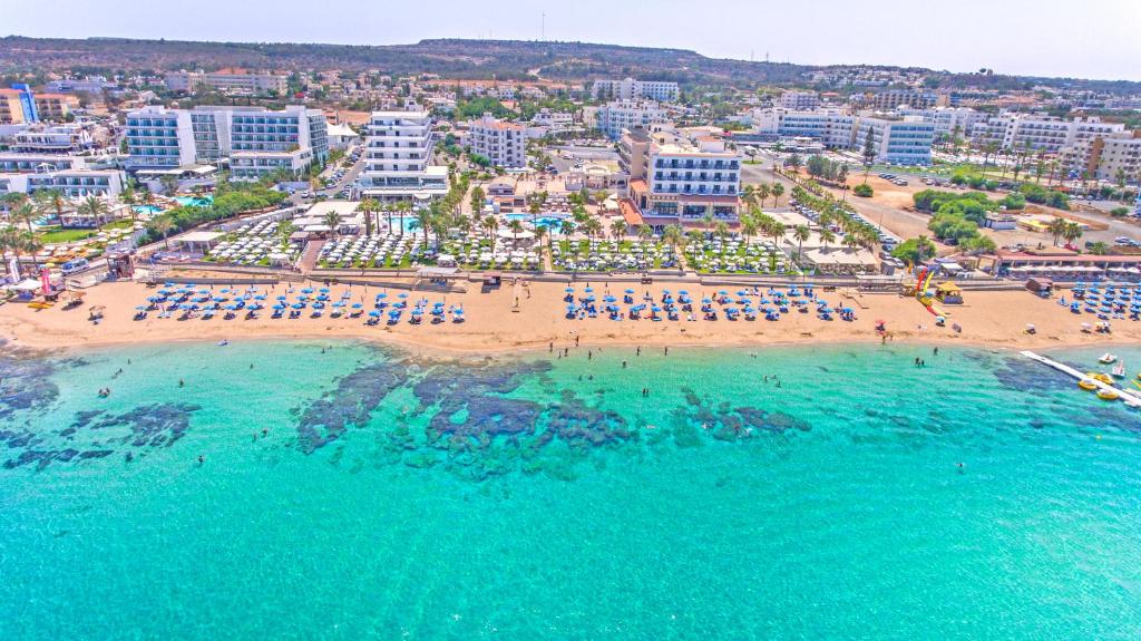 an aerial view of a beach and the ocean at Vrissiana Boutique Beach Hotel in Protaras